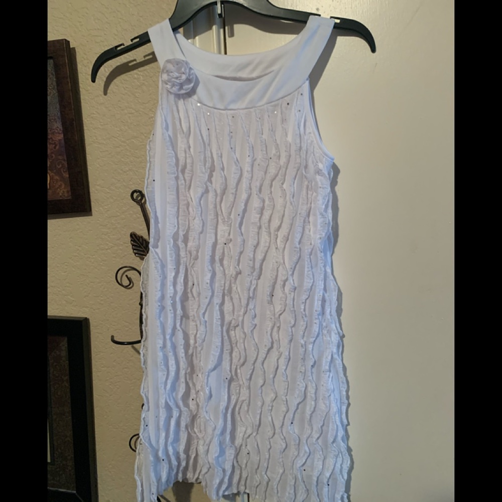 Cute white ruffle dress with rose accent